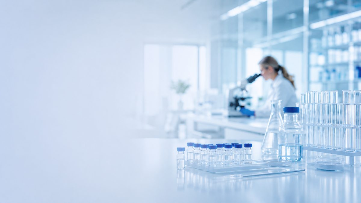 Laboratory bench with racks of vials and glassware
